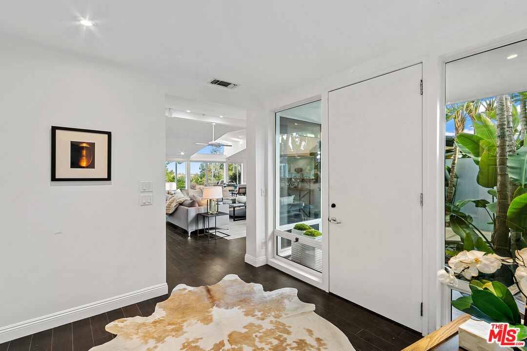 1820 Braemar Road Pasadena, CA 91103 - Photo 26 of 75 a living room with furniture and a potted plant