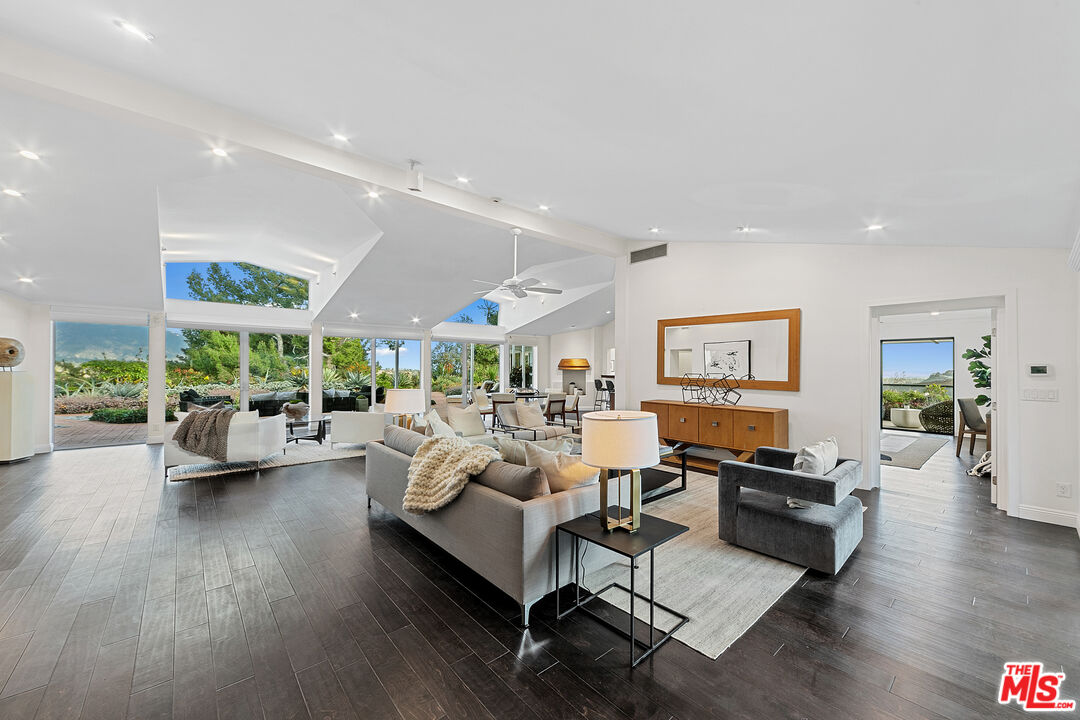 1820 Braemar Road Pasadena, CA 91103 - Photo 27 of 75 a living room with fireplace furniture and a wooden floor
