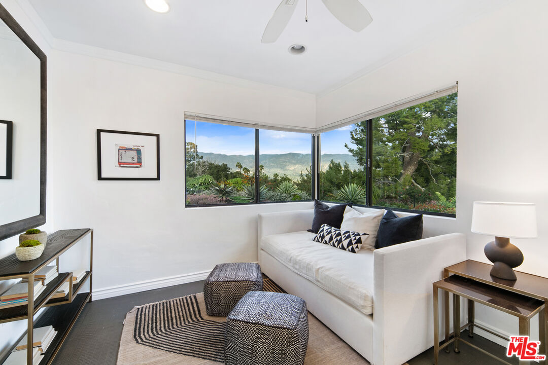1820 Braemar Road Pasadena, CA 91103 - Photo 37 of 75 a living room with furniture and a floor to ceiling window