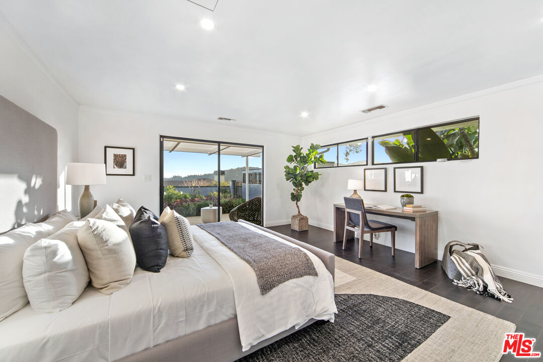 1820 Braemar Road Pasadena, CA 91103 - Photo 42 of 75 a bedroom with a bed a large window and chair