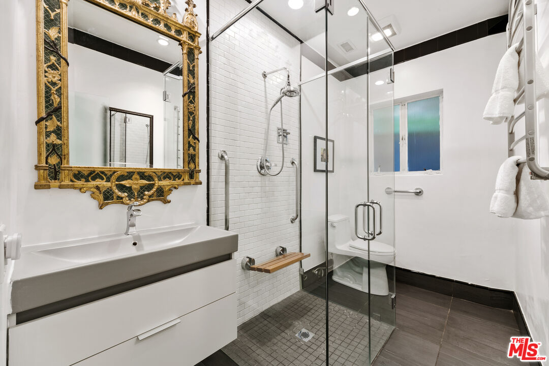 1820 Braemar Road Pasadena, CA 91103 - Photo 46 of 75 a bathroom with a sink a toilet and shower