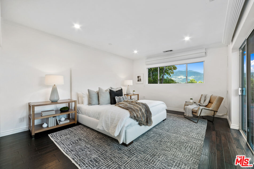 1820 Braemar Road Pasadena, CA 91103 - Photo 47 of 75 a room with a bed and wooden floor