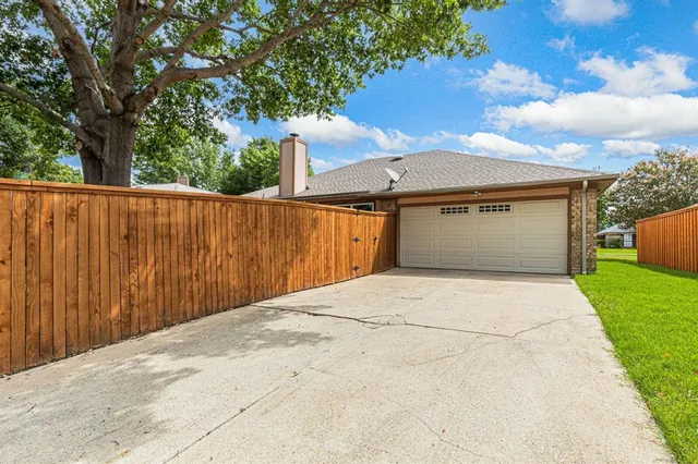 a view of backyard with green space