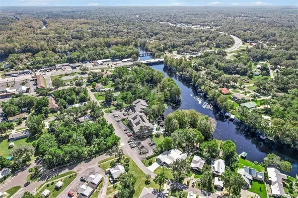 an aerial view of residential houses with outdoor space