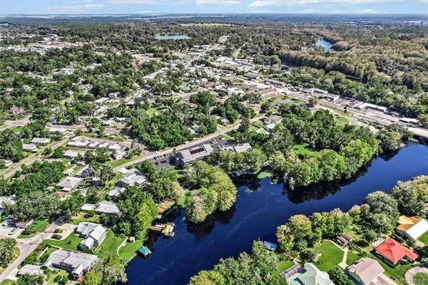 an aerial view of a house with a yard