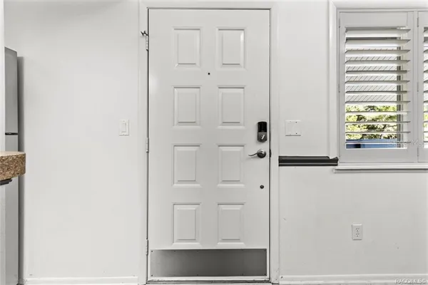 a view of a livingroom with furniture and stairs