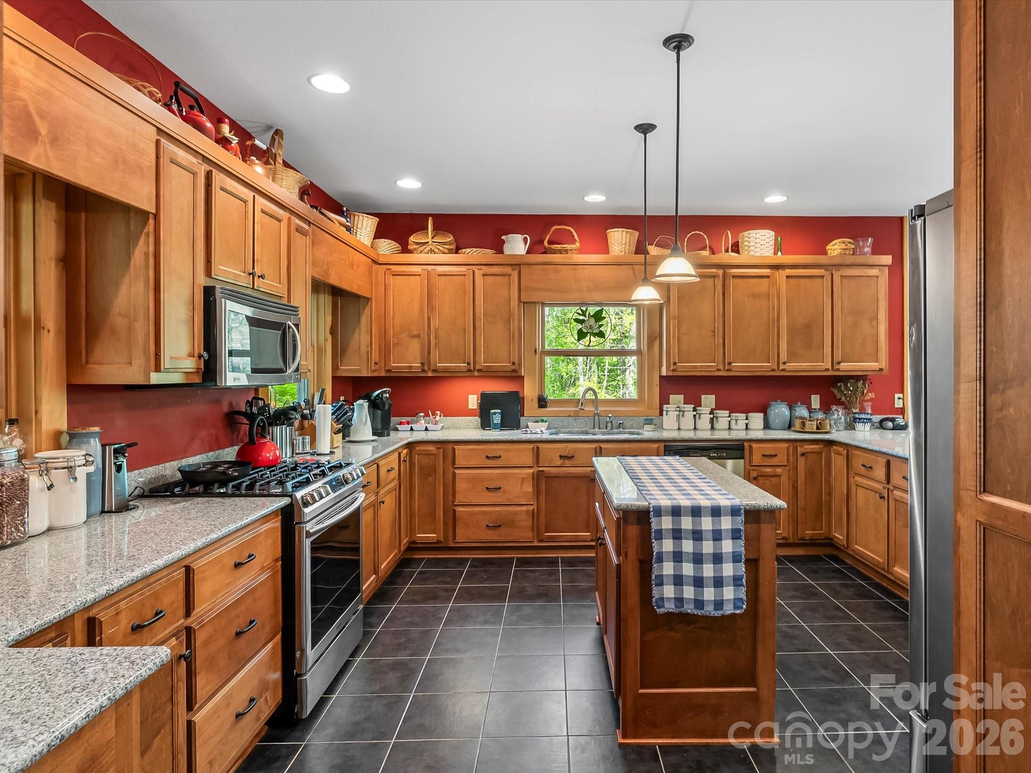 917 Otter Mountain Road Topton, NC 28781 - Photo 16 of 48 a kitchen with stainless steel appliances a stove sink and cabinets