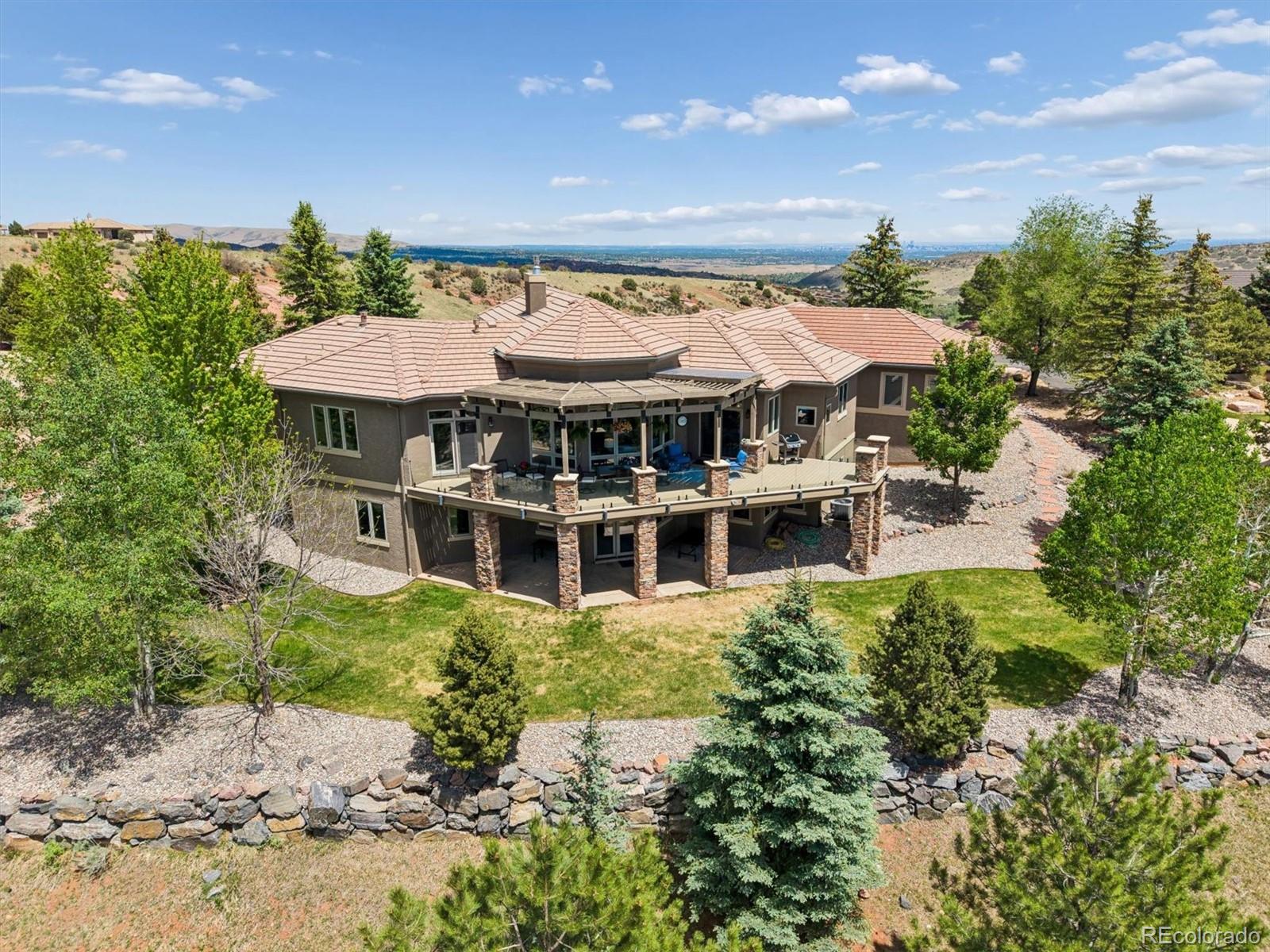16422 Rocky Point Lane Morrison, CO 80465 - Photo 1 of 50 an aerial view of a house with a yard and lake view