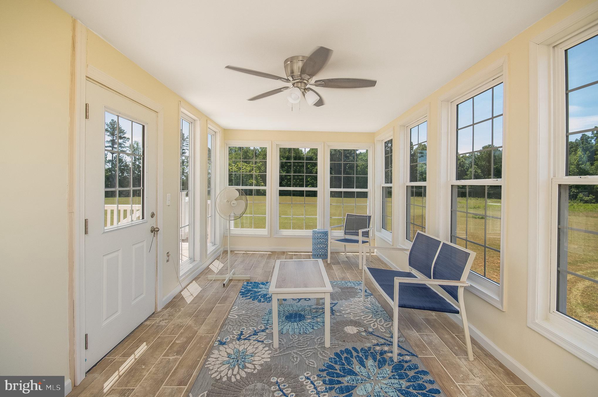 11425 Custers Trace Spotsylvania, VA 22553 - Photo 17 of 60 a dining room with furniture a chandelier and a rug