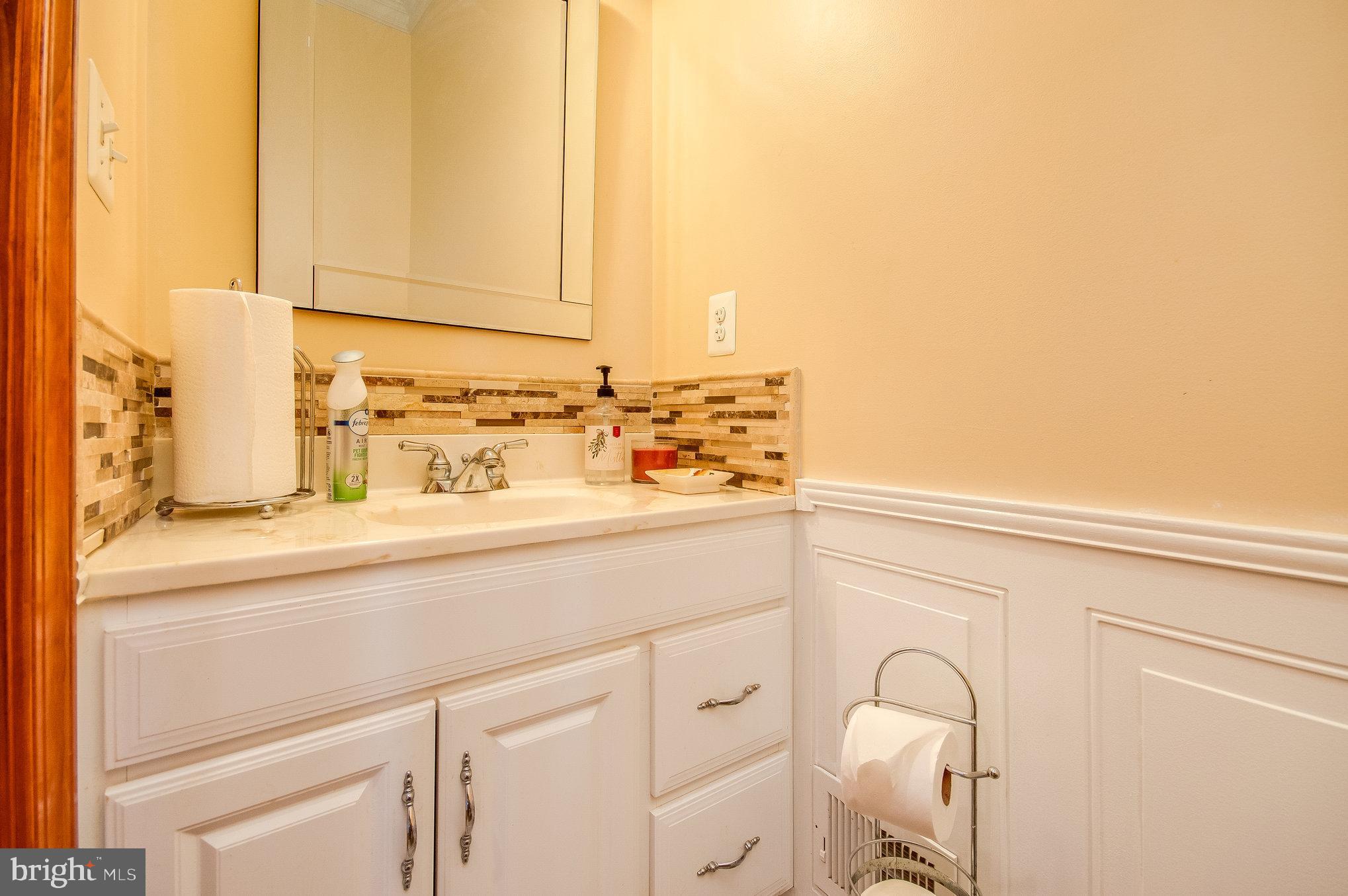 11425 Custers Trace Spotsylvania, VA 22553 - Photo 19 of 60 a bathroom with a sink and a mirror