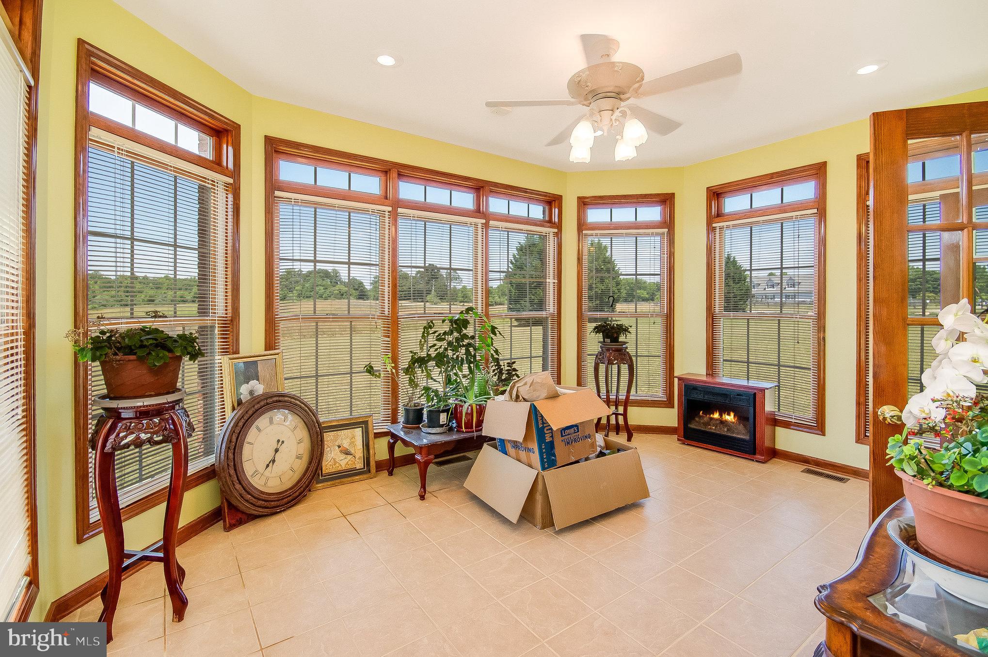 11425 Custers Trace Spotsylvania, VA 22553 - Photo 24 of 60 a living room with furniture a ceiling fan and a large window