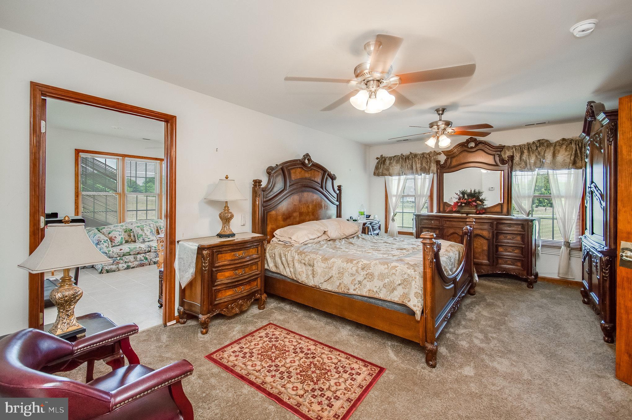 11425 Custers Trace Spotsylvania, VA 22553 - Photo 26 of 60 a bedroom with a bed and wooden floor