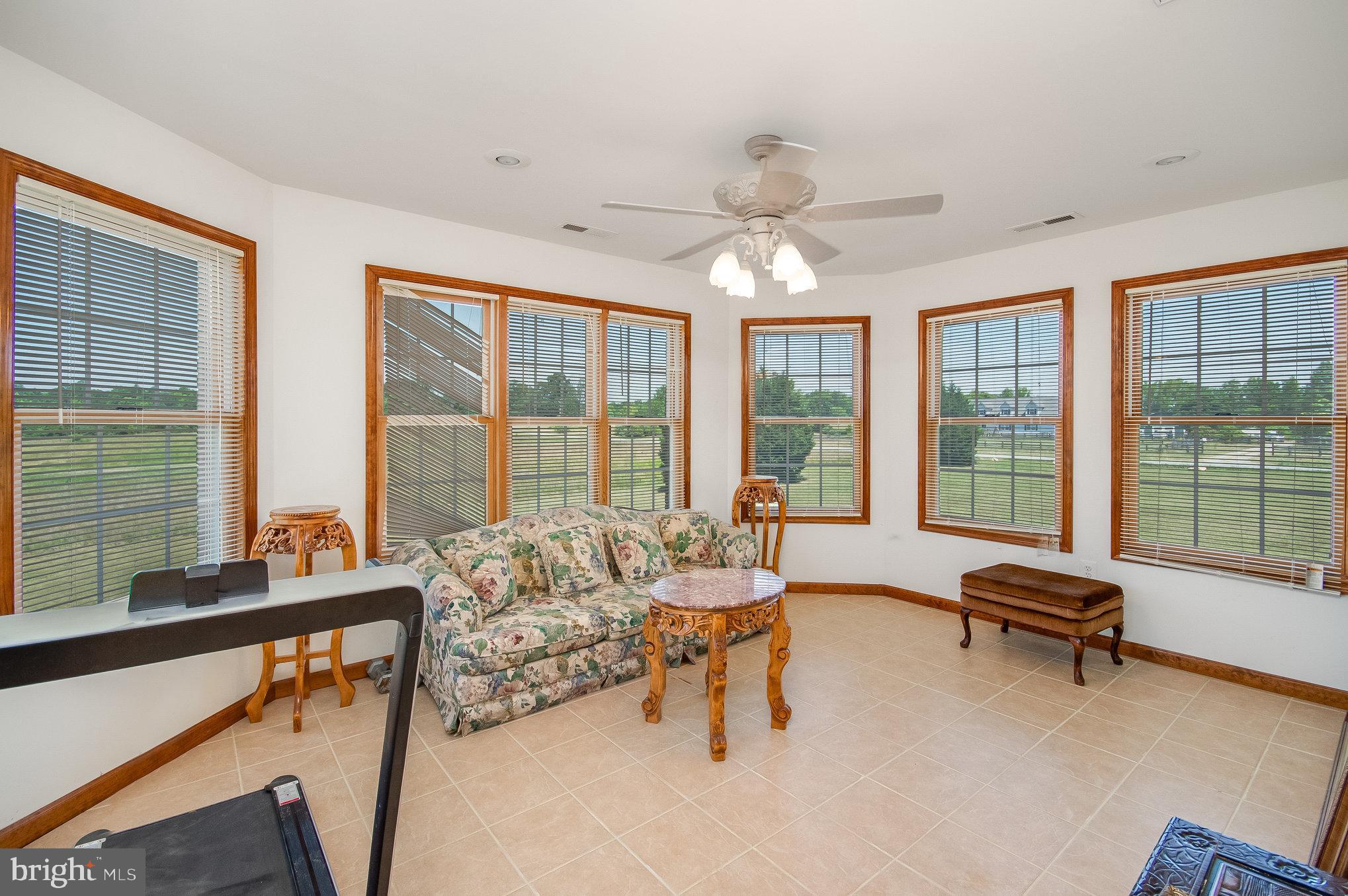 11425 Custers Trace Spotsylvania, VA 22553 - Photo 30 of 60 a living room with furniture and floor to ceiling windows
