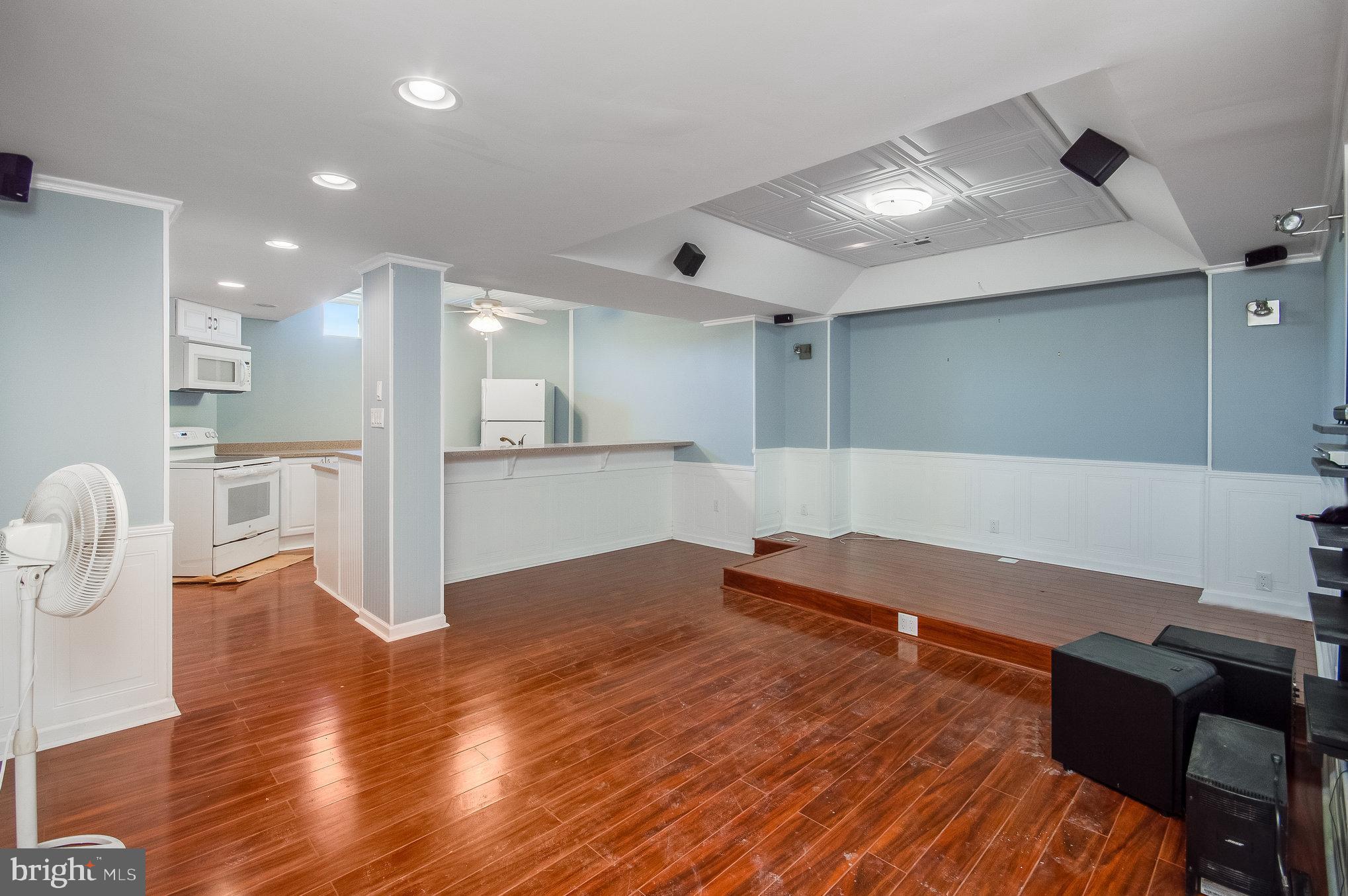 11425 Custers Trace Spotsylvania, VA 22553 - Photo 47 of 60 a view of kitchen and empty room with wooden floor