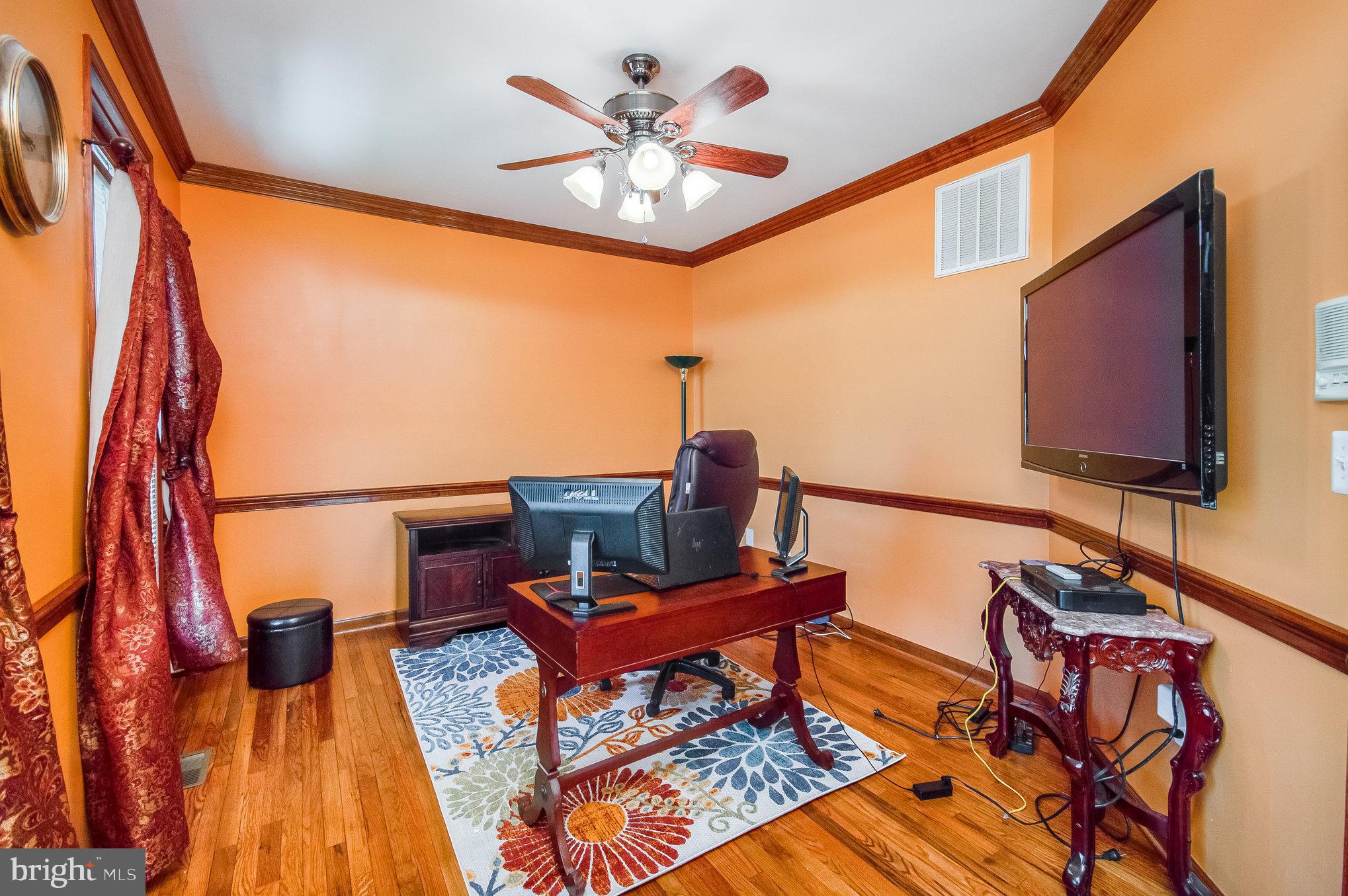 11425 Custers Trace Spotsylvania, VA 22553 - Photo 5 of 60 a living room with furniture a rug and a fireplace