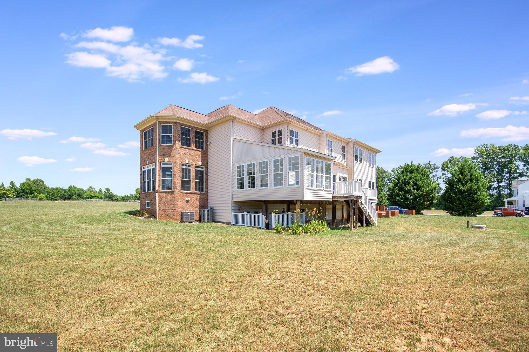 11425 Custers Trace Spotsylvania, VA 22553 - Photo 51 of 60 a view of a house with a yard and sitting area