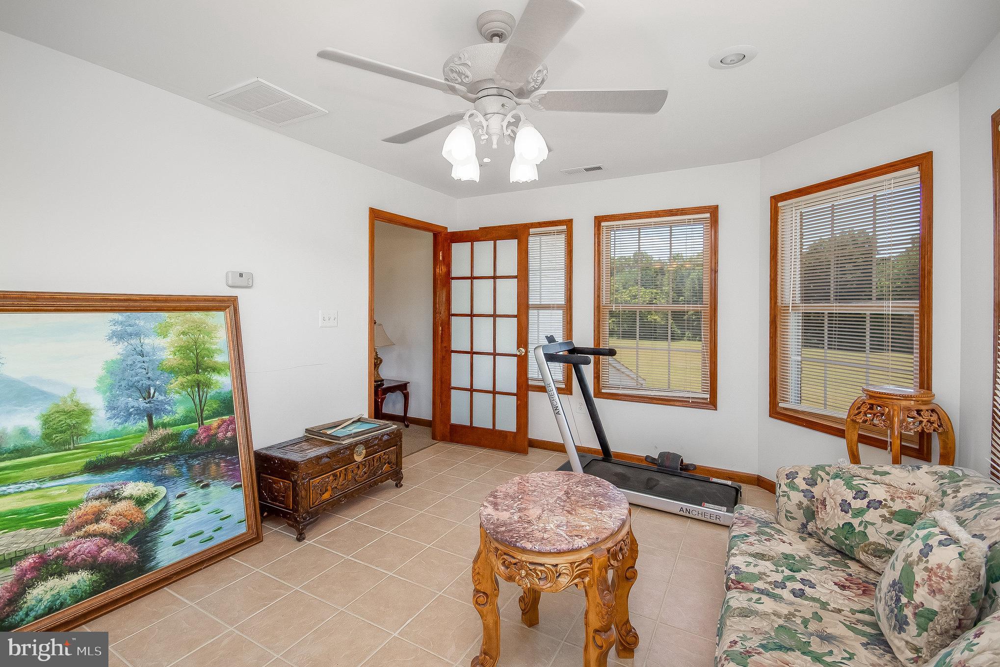 11425 Custers Trace Spotsylvania, VA 22553 - Photo 7 of 60 a spacious bedroom with a bed and a large window