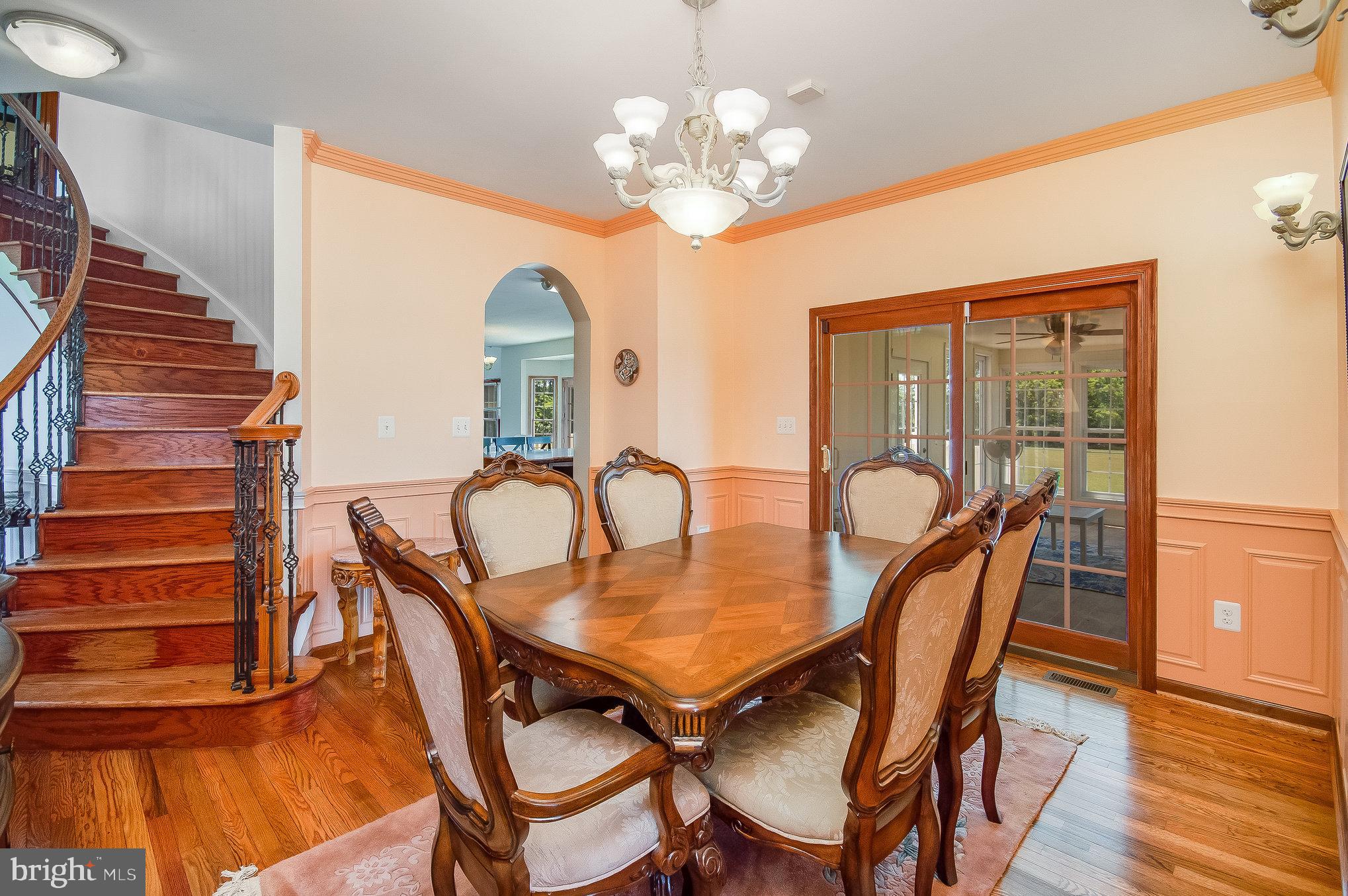 11425 Custers Trace Spotsylvania, VA 22553 - Photo 10 of 60 a dining room with furniture a chandelier and wooden floor