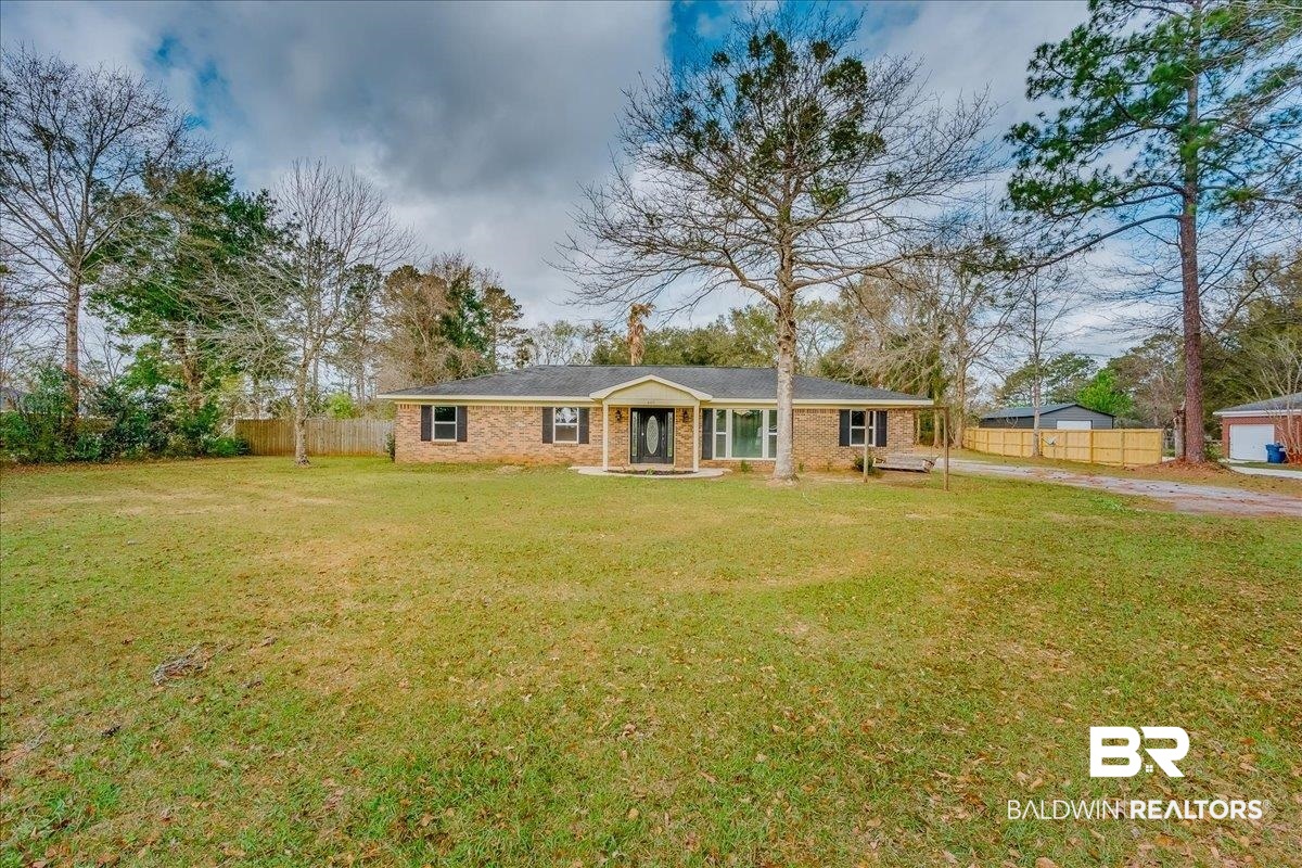 440 Dykes Road Mobile, AL 36608 - Photo 46 of 49 Ranch-style house with a front yard, fence, and driveway