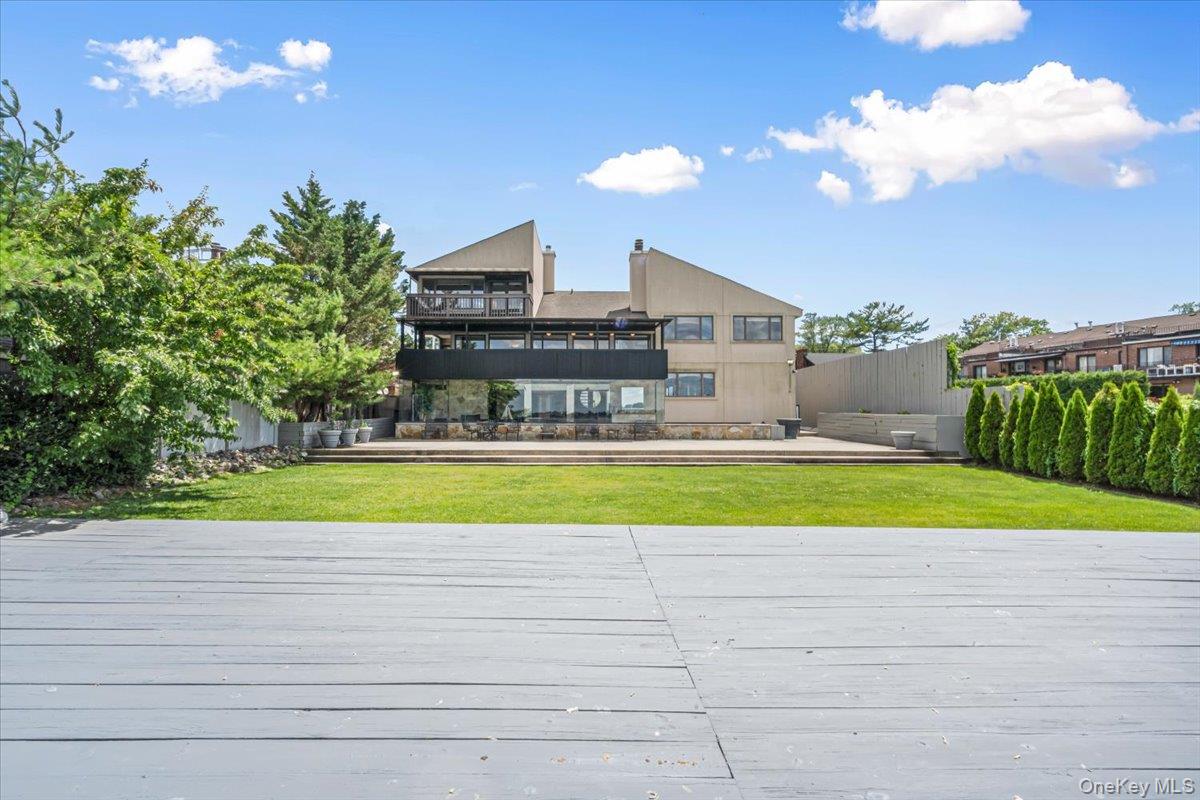 154-43 Riverside Drive Queens, NY 11357 - Photo 35 of 41 a view of a house with a swimming pool