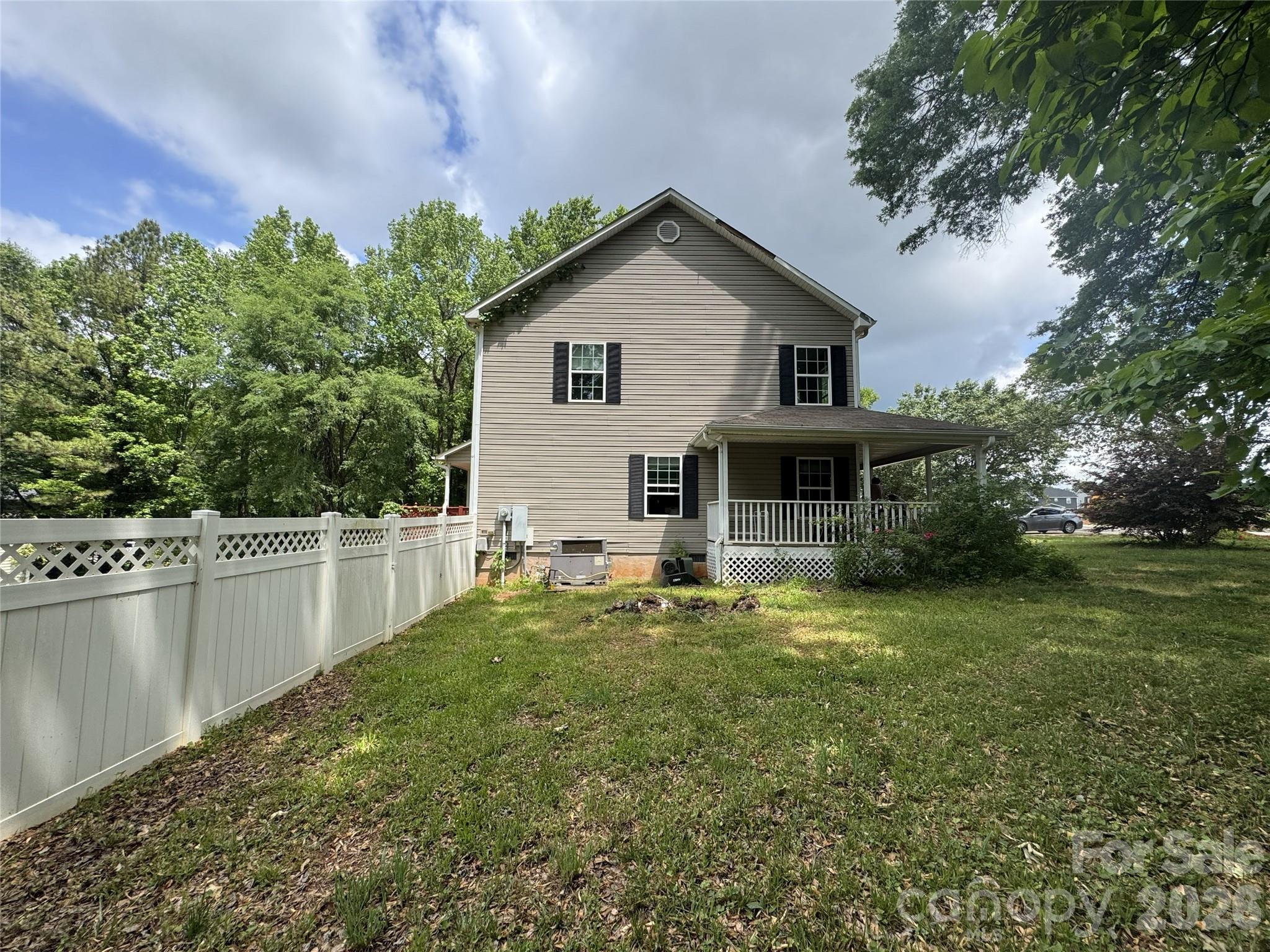 8441 Shelley Mullis Road Fort Mill, SC 29707 - Photo 3 of 23 a front view of a house with a yard