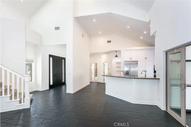 a kitchen with stainless steel appliances a refrigerator and a sink