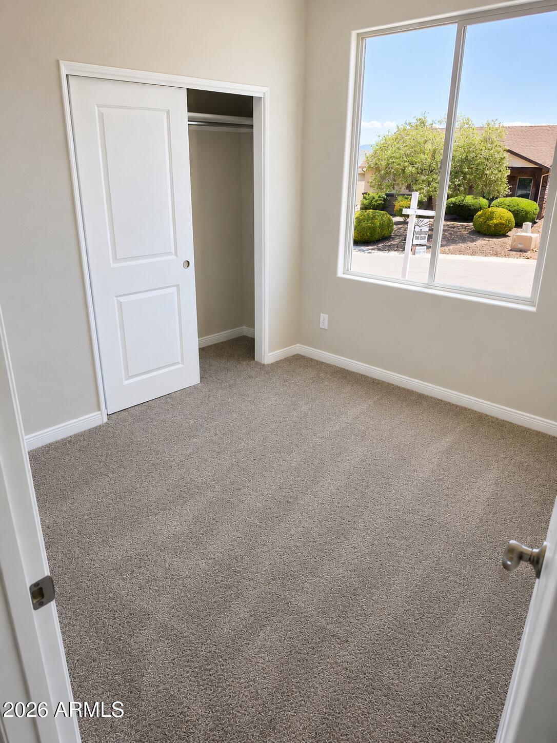 786 Flat Iron Road, Unit LOT 503 Clarkdale, AZ 86324 - Photo 9 of 14 an empty room with a window