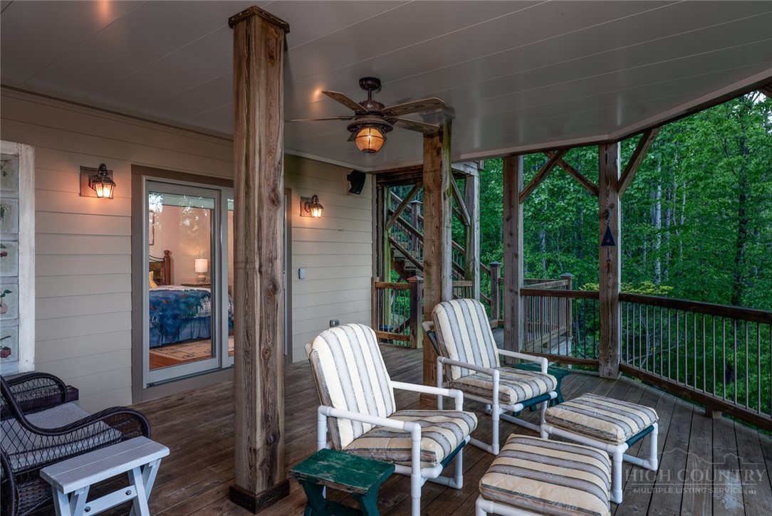 171 Camp Davis Road Banner Elk, NC 28604 - Photo 45 of 48 a view of a patio with a table chairs and backyard