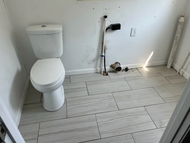 a bathroom with a toilet and a sink