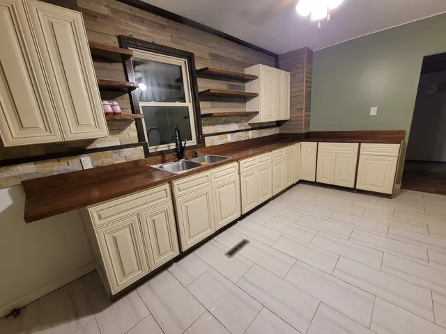 a kitchen with a sink and cabinets