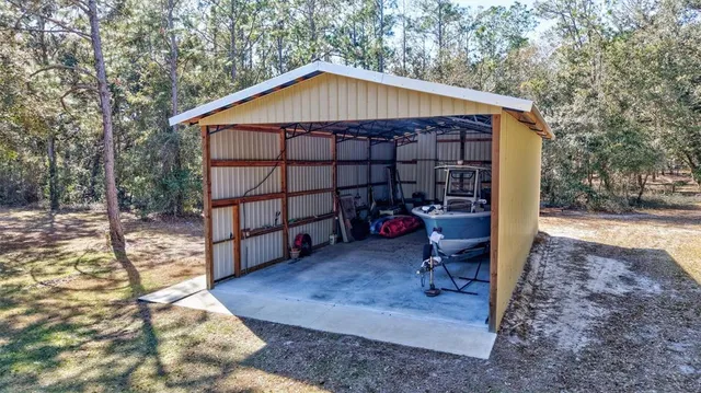 a kitchen with stainless steel appliances granite countertop wooden cabinets a stove a sink and a granite counter tops