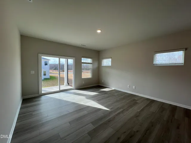 a kitchen with stainless steel appliances granite countertop a sink a stove and cabinets