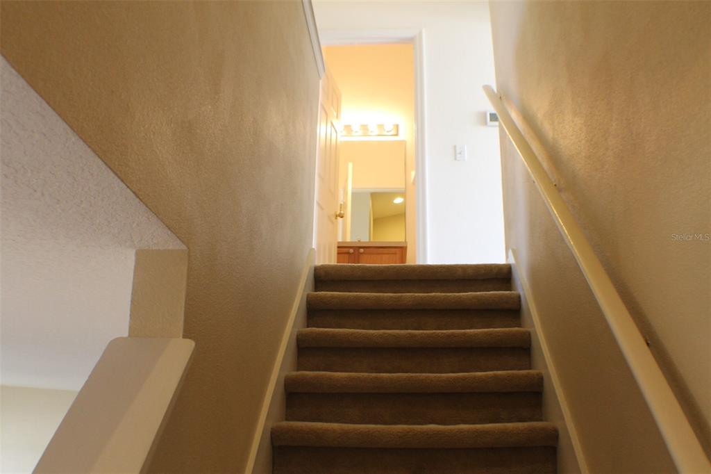 3336 Santa Rita Lane Land O Lakes, FL 34639 - Photo 19 of 60 a view of entryway and hall with wooden floor