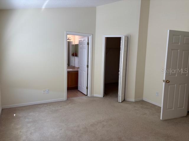 3336 Santa Rita Lane Land O Lakes, FL 34639 - Photo 22 of 60 an empty room with closet and wooden floor