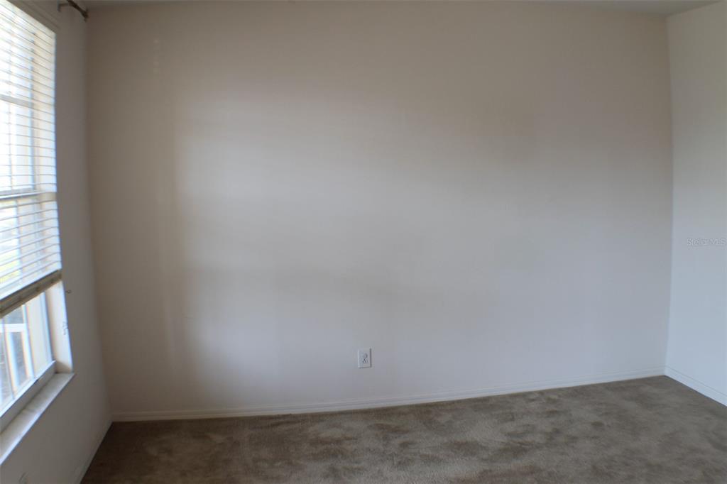 3336 Santa Rita Lane Land O Lakes, FL 34639 - Photo 23 of 60 an empty room with windows