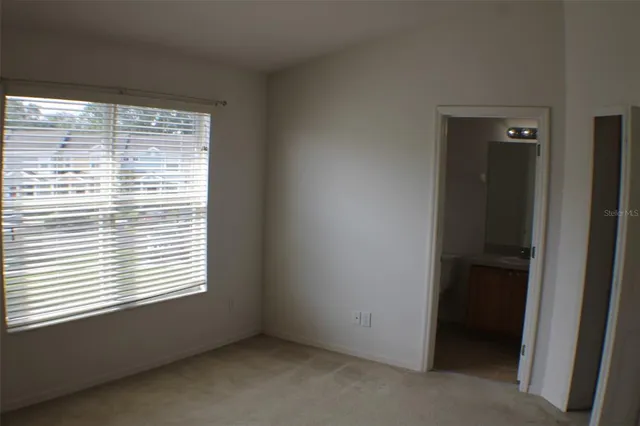 a bathroom with a toilet and a bathtub