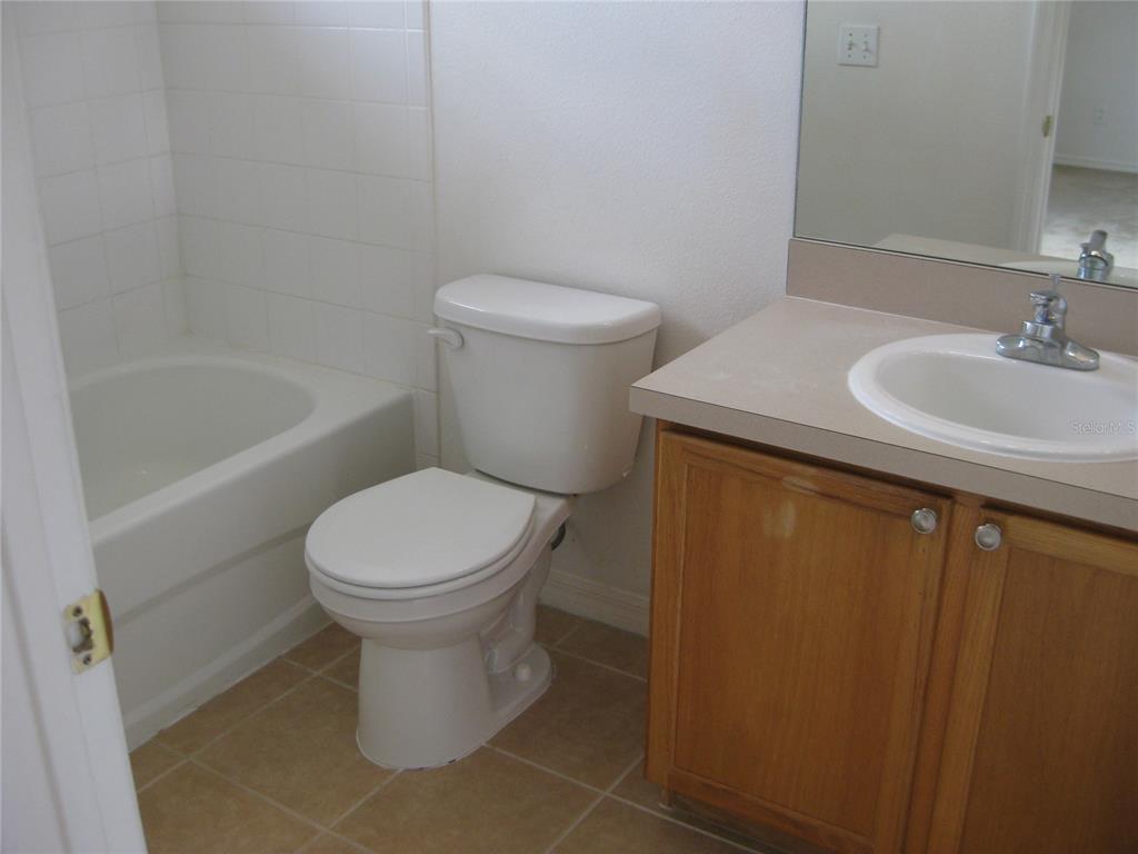 3336 Santa Rita Lane Land O Lakes, FL 34639 - Photo 25 of 60 a bathroom with a sink toilet and bathtub