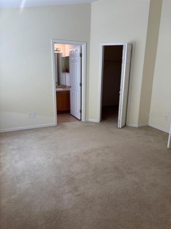 3336 Santa Rita Lane Land O Lakes, FL 34639 - Photo 31 of 60 an empty room with an entryway and wooden floor