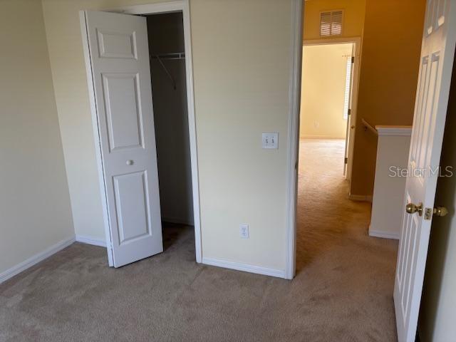 3336 Santa Rita Lane Land O Lakes, FL 34639 - Photo 42 of 60 an empty room with windows