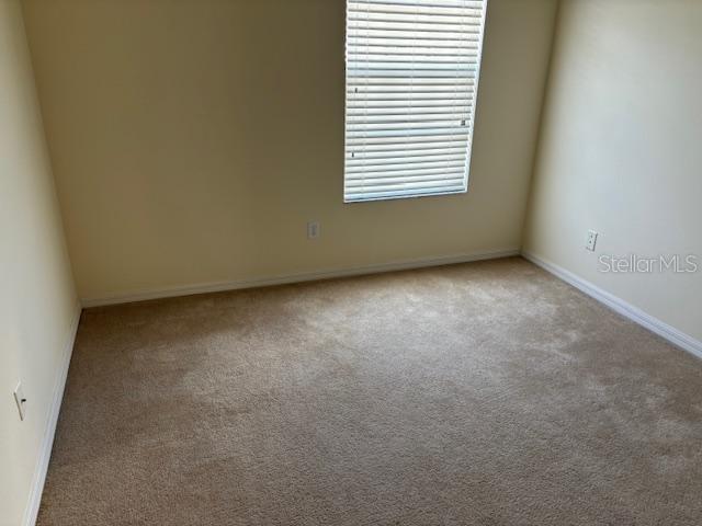 3336 Santa Rita Lane Land O Lakes, FL 34639 - Photo 43 of 60 an empty room with a window