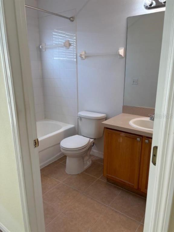 3336 Santa Rita Lane Land O Lakes, FL 34639 - Photo 45 of 60 a white toilet sitting next to a bathroom sink