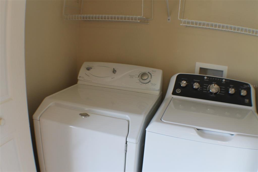 3336 Santa Rita Lane Land O Lakes, FL 34639 - Photo 47 of 60 a utility room with dryer and washer