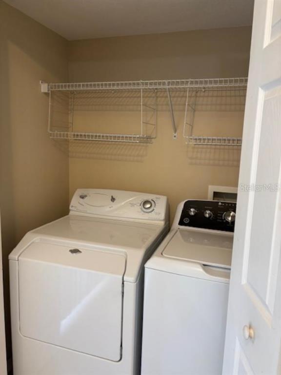 3336 Santa Rita Lane Land O Lakes, FL 34639 - Photo 48 of 60 a utility room with dryer and washer
