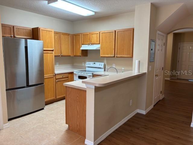 3336 Santa Rita Lane Land O Lakes, FL 34639 - Photo 52 of 60 a kitchen with stainless steel appliances granite countertop a refrigerator a stove a sink and a refrigerator