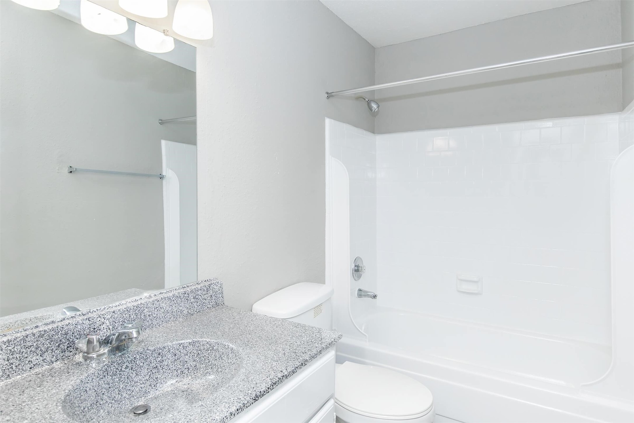 18001 Cypress Trace Road, Unit 3301 Houston, TX 77090 - Photo 17 of 34 a bathroom with a granite countertop sink toilet and shower