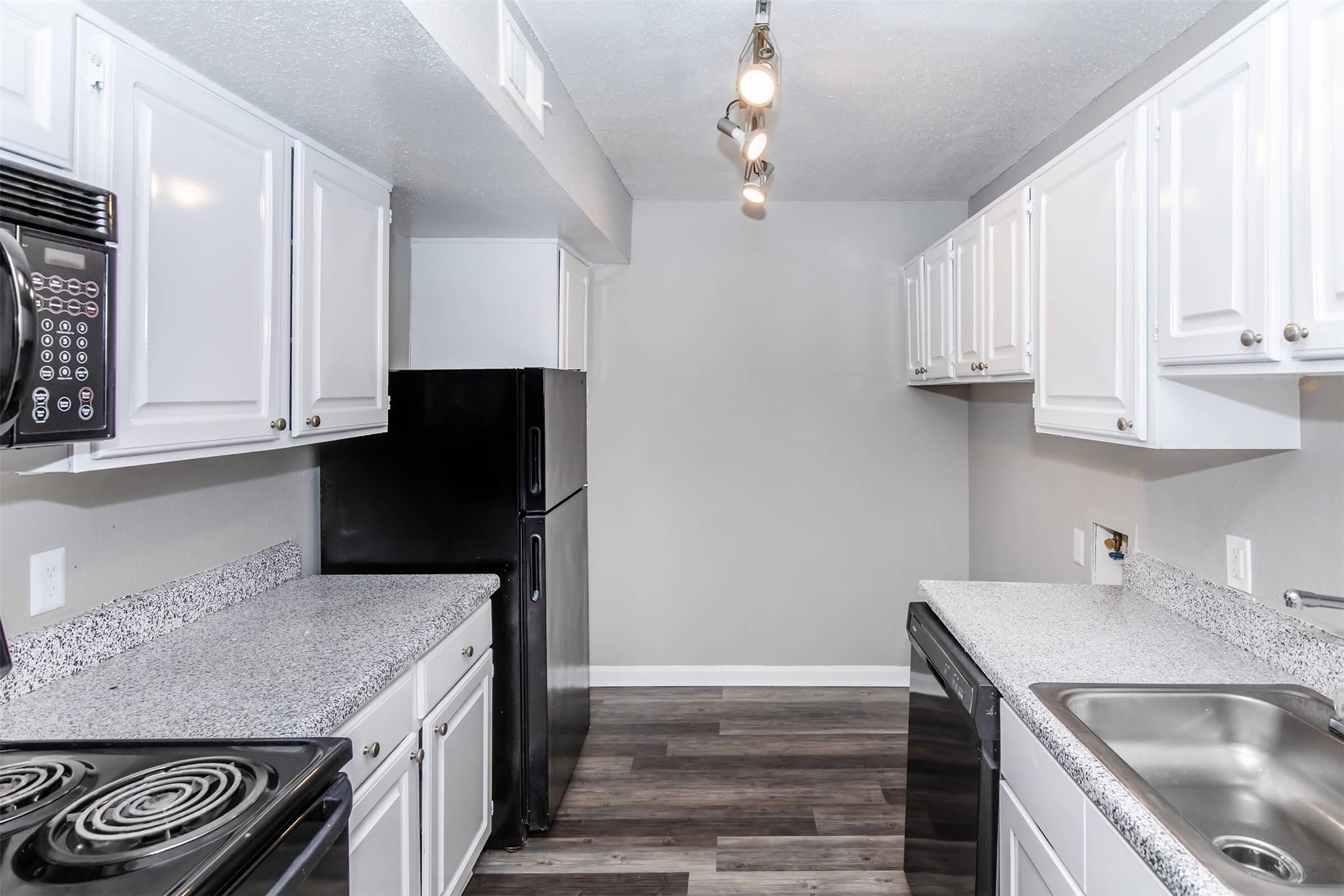 18001 Cypress Trace Road, Unit 3301 Houston, TX 77090 - Photo 6 of 34 a kitchen with stainless steel appliances granite countertop a sink stove and refrigerator