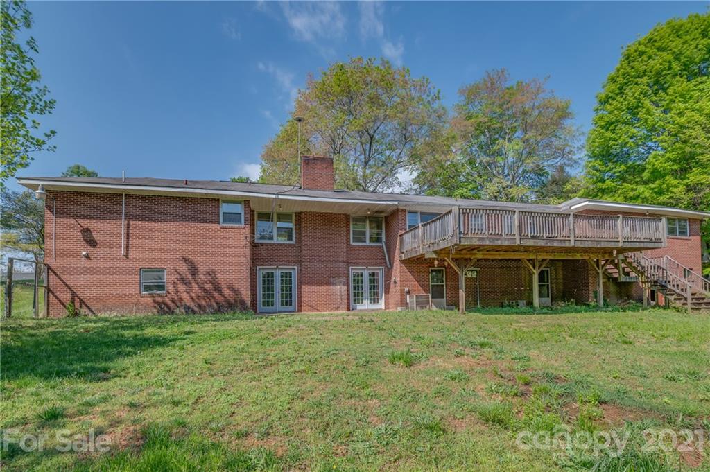 134 Chimney Rock Road Rutherfordton, NC 28139 - Photo 5 of 33 a view of a house with a big yard and large trees