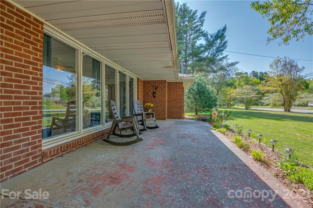 134 Chimney Rock Road Rutherfordton, NC 28139 - Photo 8 of 33 a view of a patio with a patio and a garden