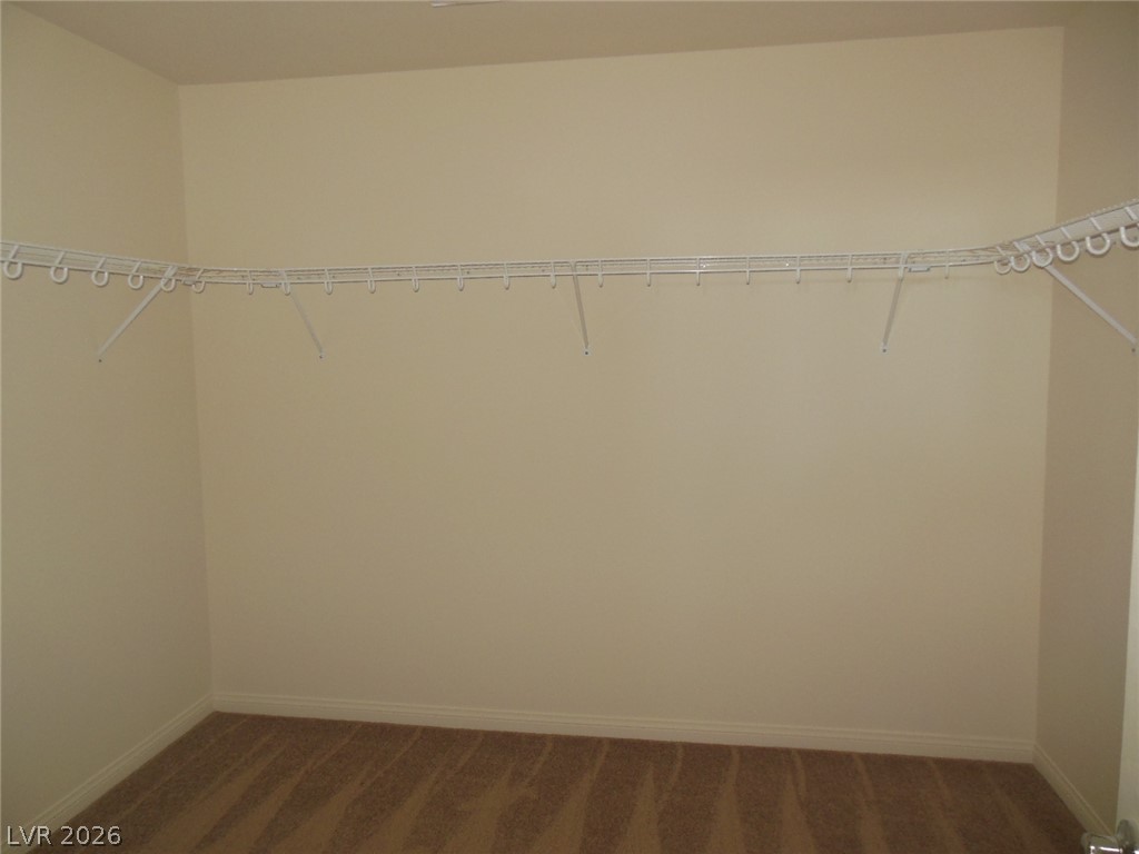 6390 Jackson Spring Road Las Vegas, NV 89118 - Photo 7 of 27 Ample storage solutions await in this practical, ready-to-organize closet space.