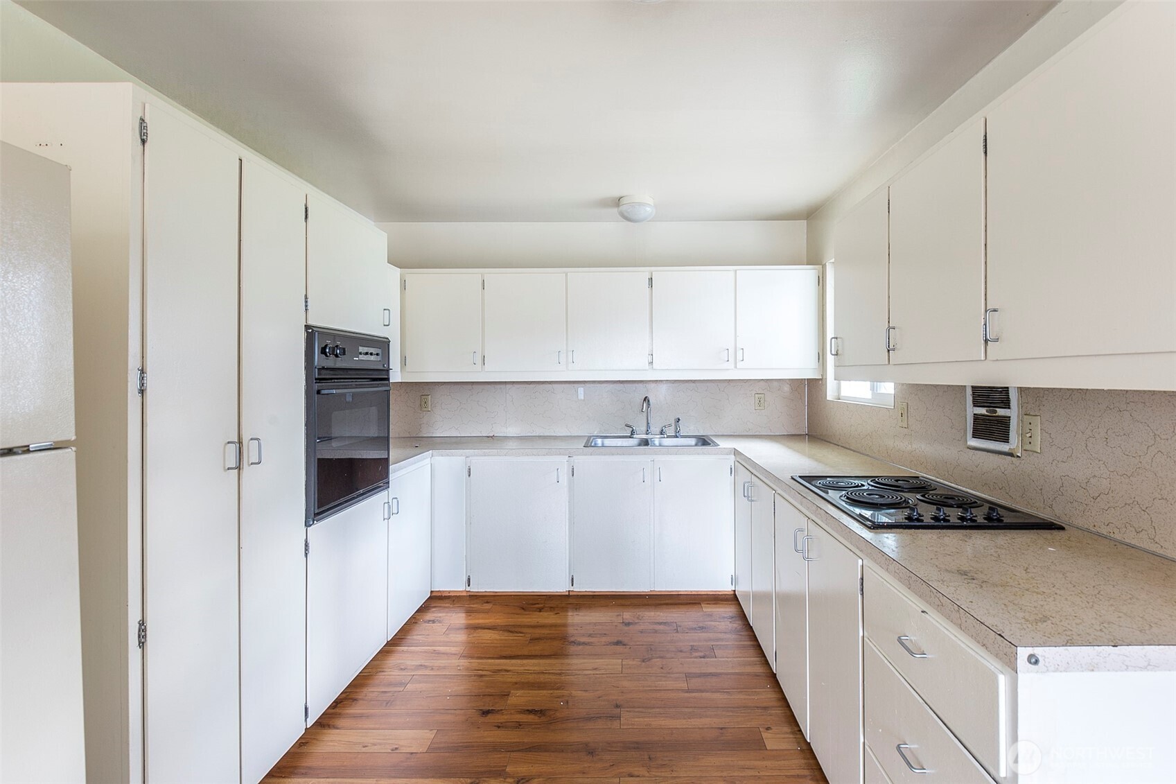 910 East 7th Street Port Angeles, WA 98362 - Photo 5 of 33 a kitchen with stainless steel appliances a refrigerator sink and cabinets